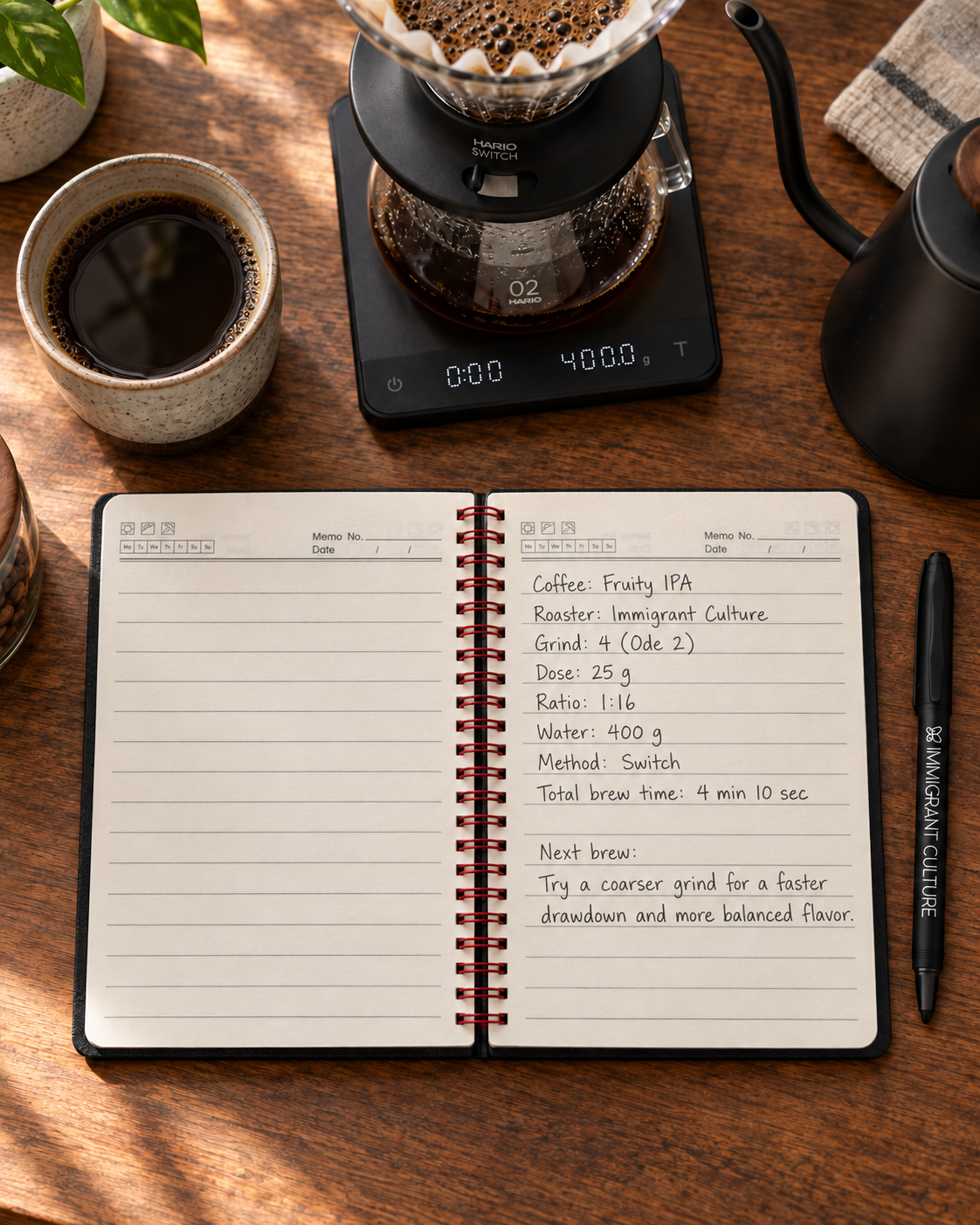 Coffee Notes Set opened to lined pages with handwritten Fruity IPA brew notes at a coffee bar