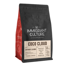 Coffee bag labeled 'Immigrant Culture' with 'Coco Cloud' on a transparent background